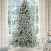 Prince flock full artificial Christmas tree lit with warm white Led lights
