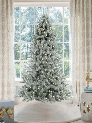 Prince flock full artificial Christmas tree lit with warm white Led lights