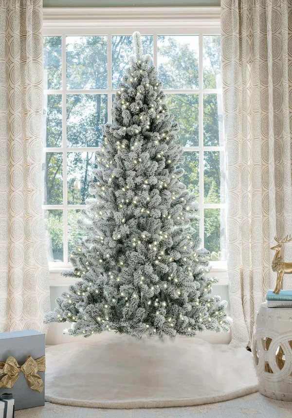 Prince flock full artificial Christmas tree lit with warm white Led lights
