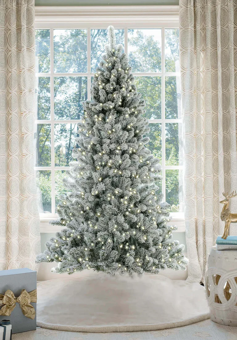 Prince flock full artificial Christmas tree lit with warm white Led lights