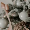 24PackWhiteEssential4 zoom view of White Essential Glass Ornaments (24 Pack) on Artificial Christmas Tree
