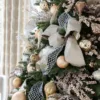 Silver Netted Stretch Ribbon layered behind a champagne bow on a decorated Christmas tree.