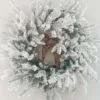 Queen Flock Wreath featuring heavily flocked branches surrounding a small pinecone deer figurine at the center.