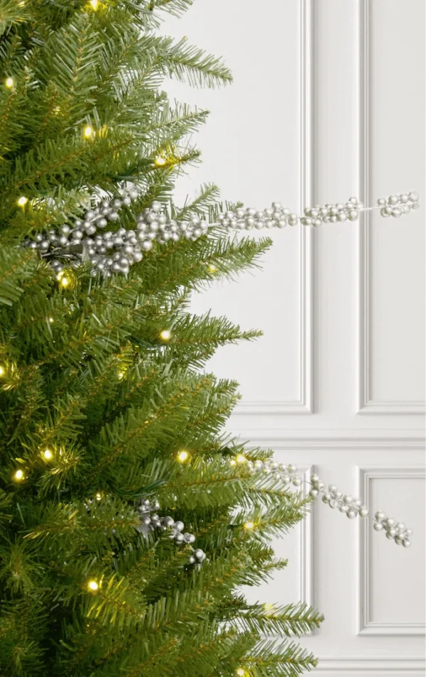 Silver Berry Picks styled horizontally on a pre-lit green Christmas tree.