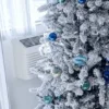 Snow Flake ornament on flocked artificial Christmas tree
