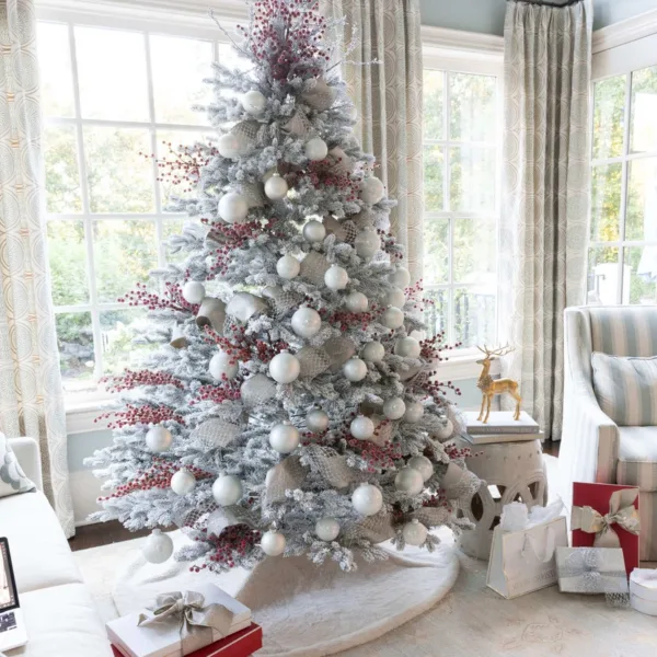 White24Essentials Elegant beautifully Styled Flock Artificial Christmas tree with White Essential Glass Ornaments (24 Pack) hanged on Flocked Artificial Christmas tree
