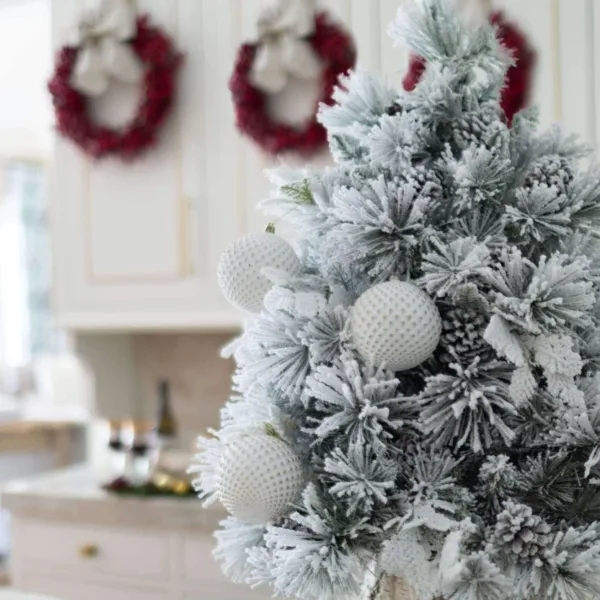 White diamond hanged on flock artificial Christmas tree