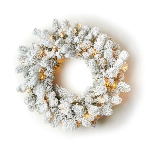 king-flock-led-wreath Pre-lit King Flock Wreath with heavily snow-flocked evergreen branches glowing with warm mini lights on a white background.