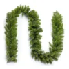Royal Fir Garland arranged in a curved wave pattern highlighting full green pine branches on a plain white background.